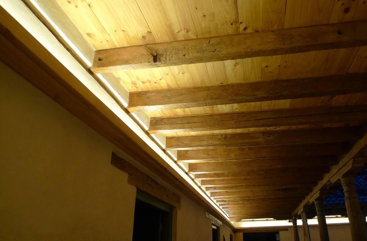 Indirect light concealed within the timber ceiling structure