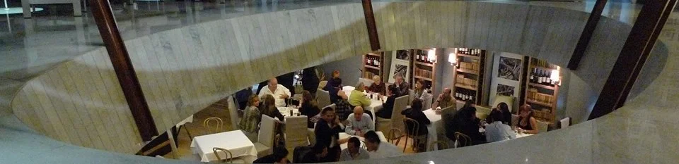 Aerial view across the dining room toward the lit domes