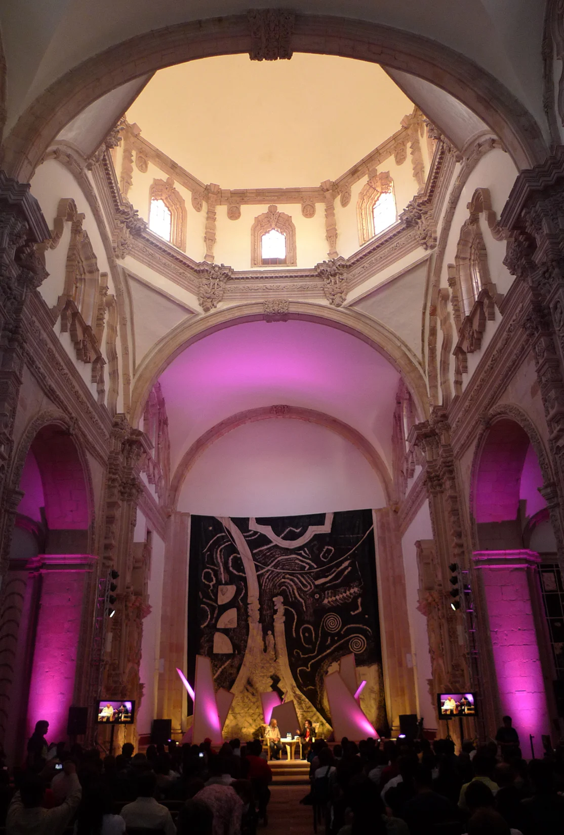 San Agustín Church staged for a session, dome and stage washed in magenta