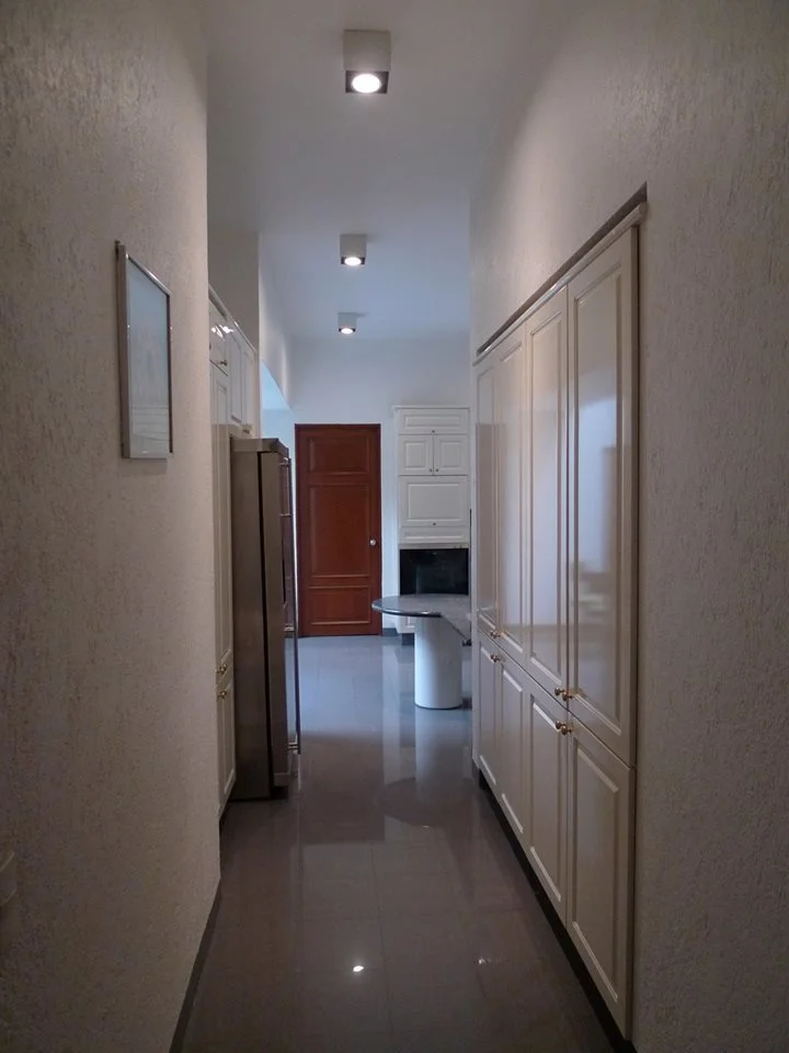 L Residence — second view of the living area at night